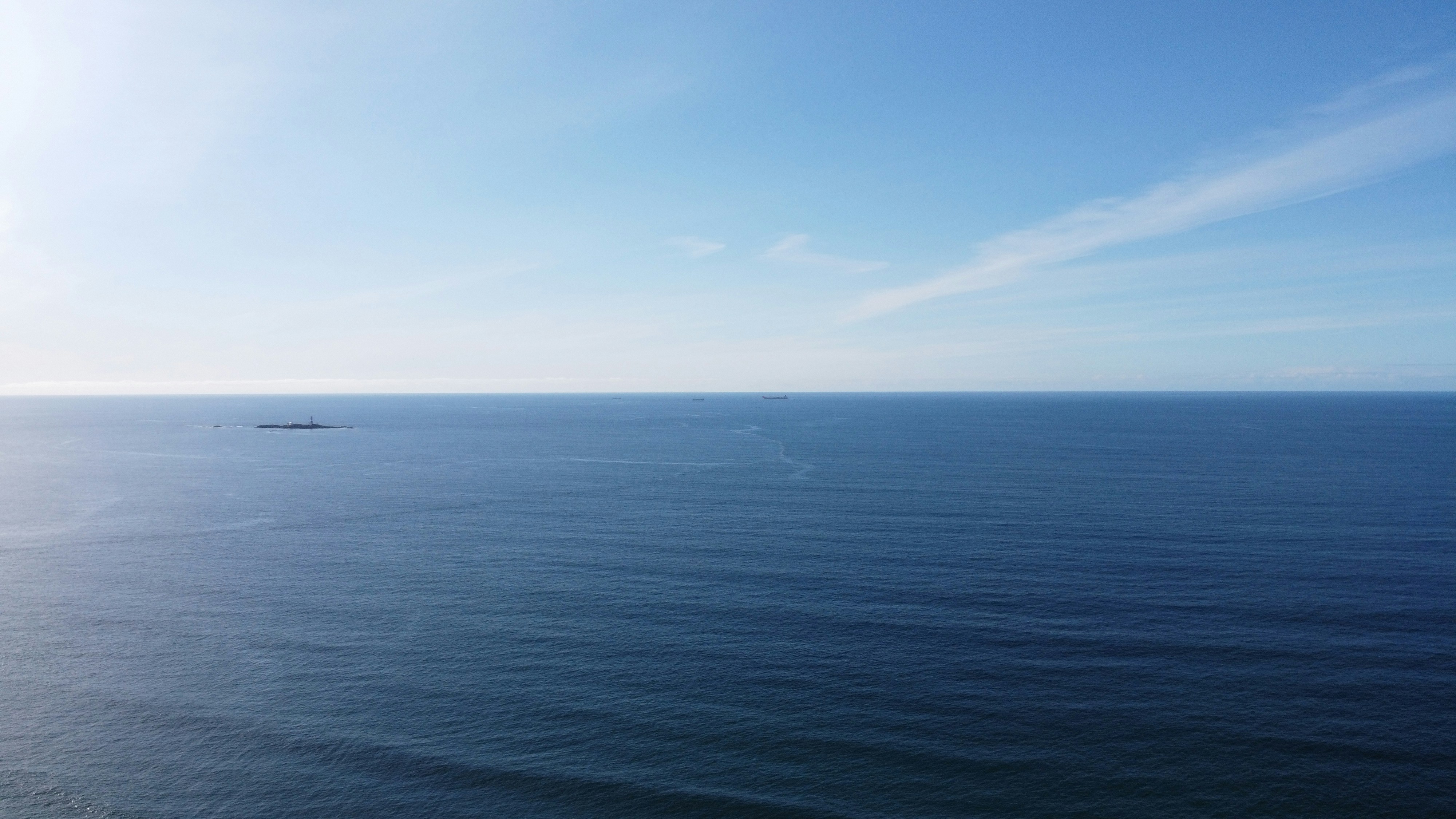 blue ocean under blue sky during daytime