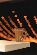 clear glass mug on white table