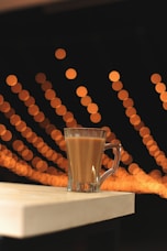 clear glass mug on white table