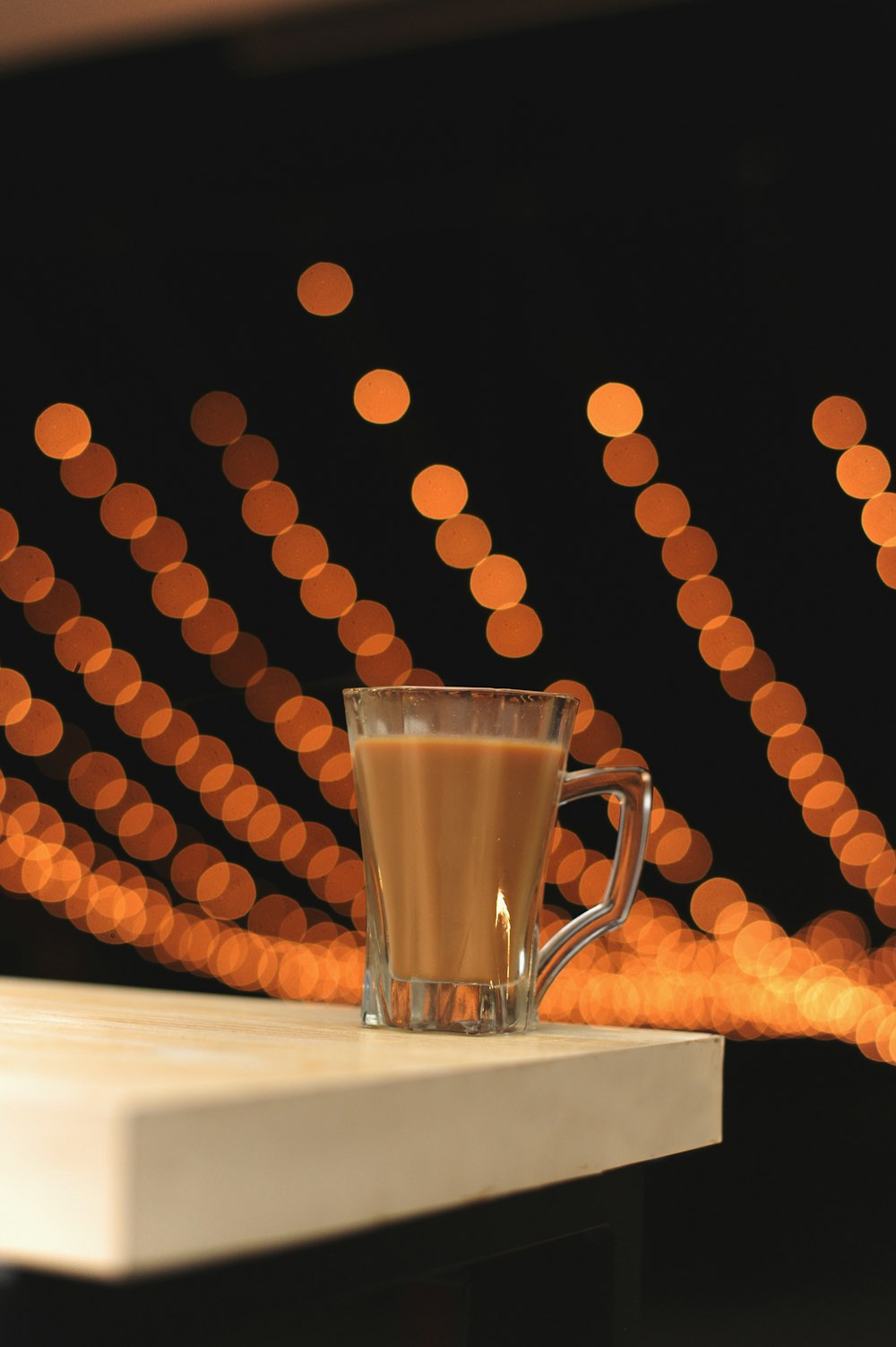 clear glass mug on white table