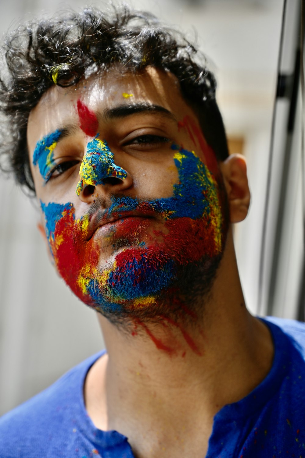 man with blue and white paint on face