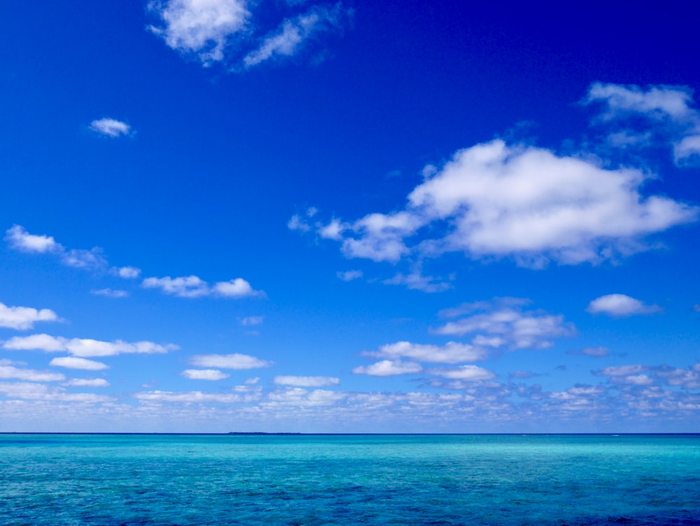 blue sky and white clouds over sea