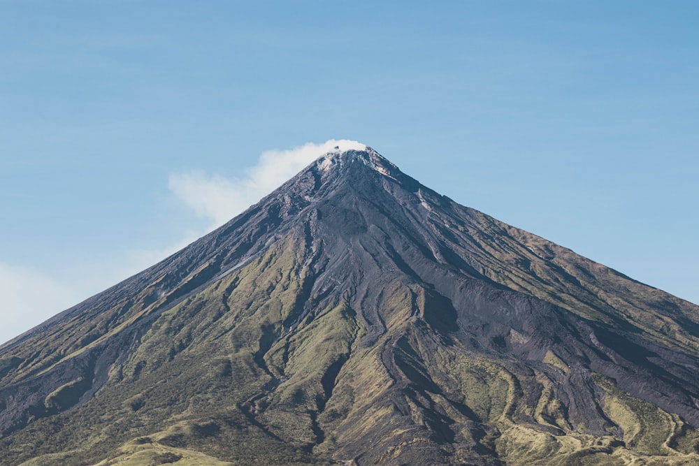 brown and black mountain under blue sky during daytime