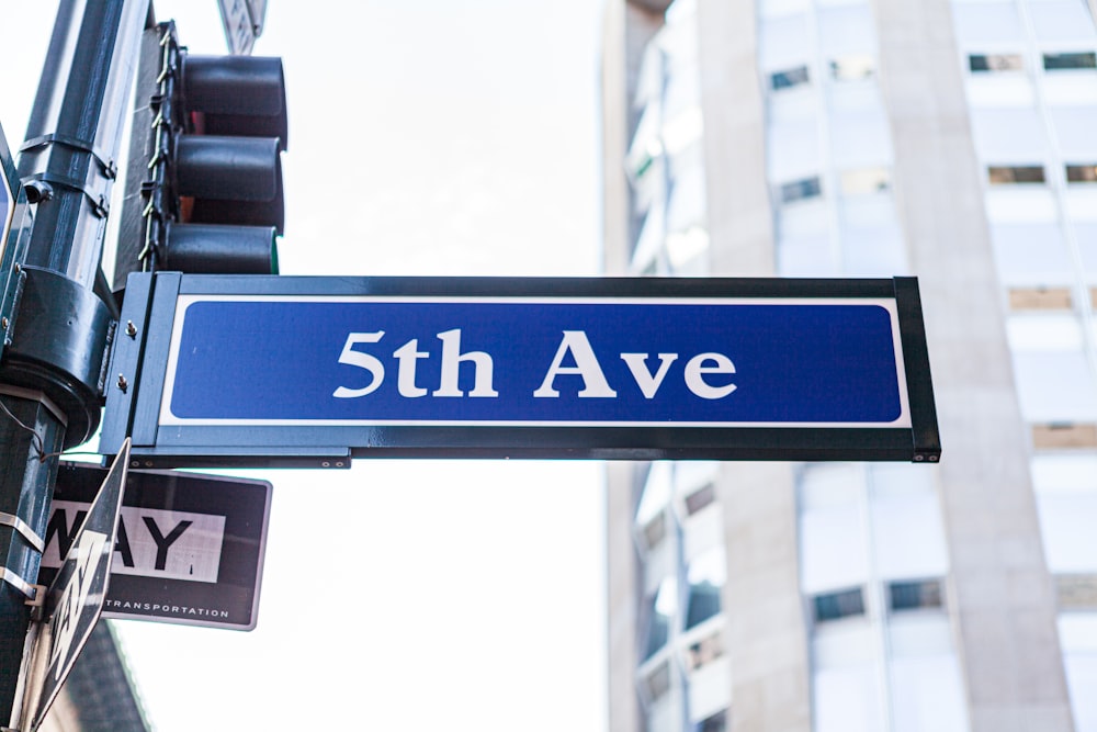 blue and white UNK street sign