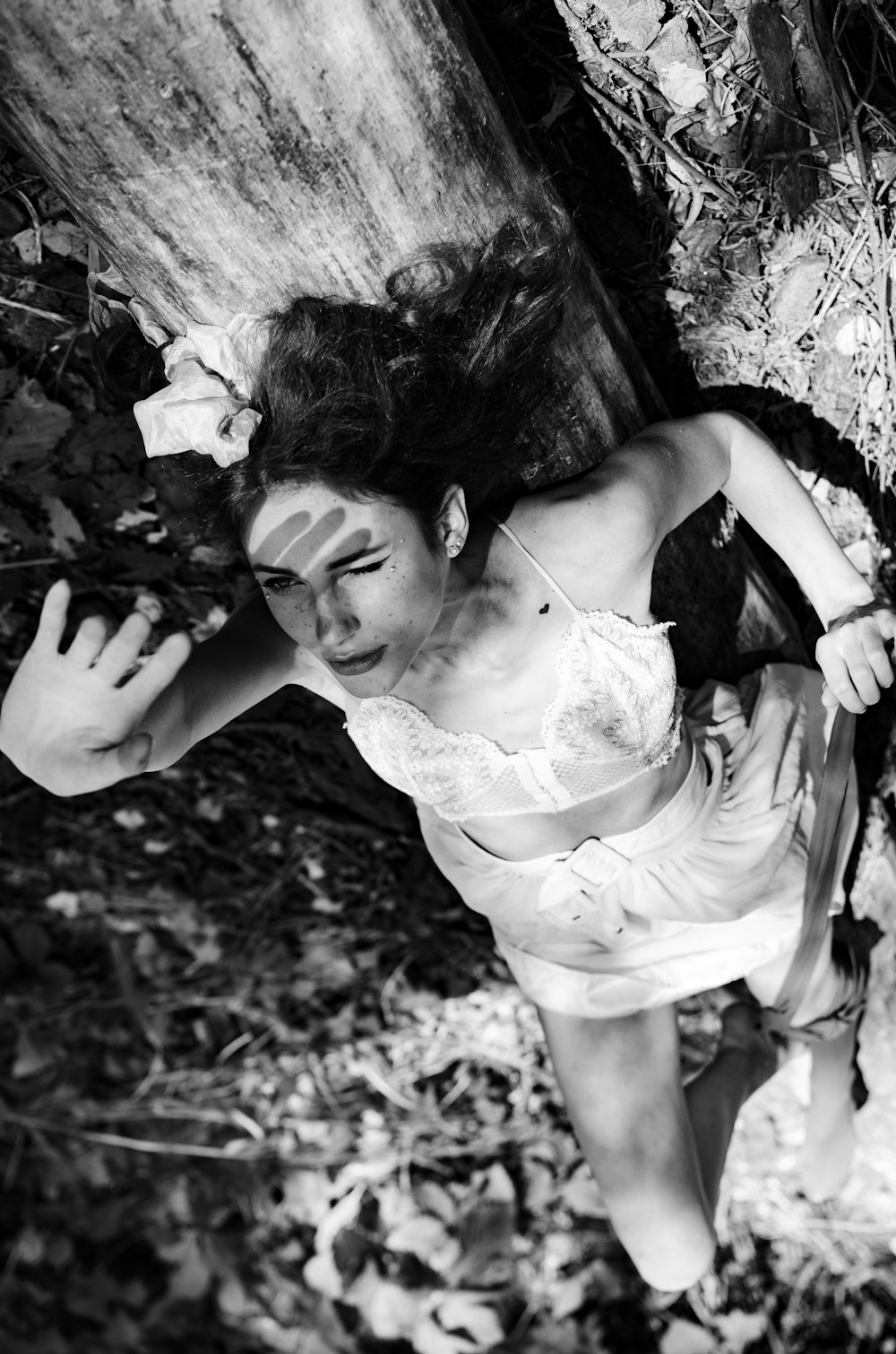 woman in white dress lying on ground