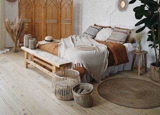 brown wooden door near brown woven armchair