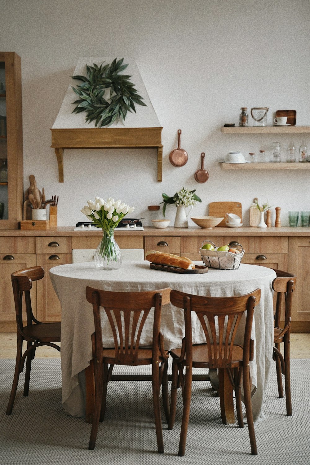 a round dining table in the kitchen.