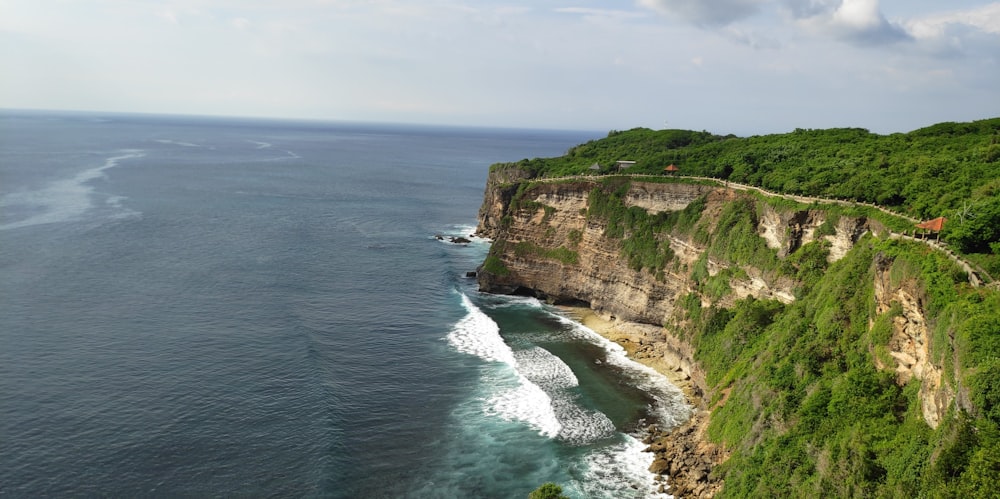 an aerial view of a cliff overlooking the ocean