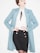 A person is wearing a stylish outfit featuring a long light blue coat over a white blouse with a black tie or accessory at the collar. The outfit is paired with a fitted black skirt adorned with gold buttons. The individual has red lipstick and their hair is styled in an updo.