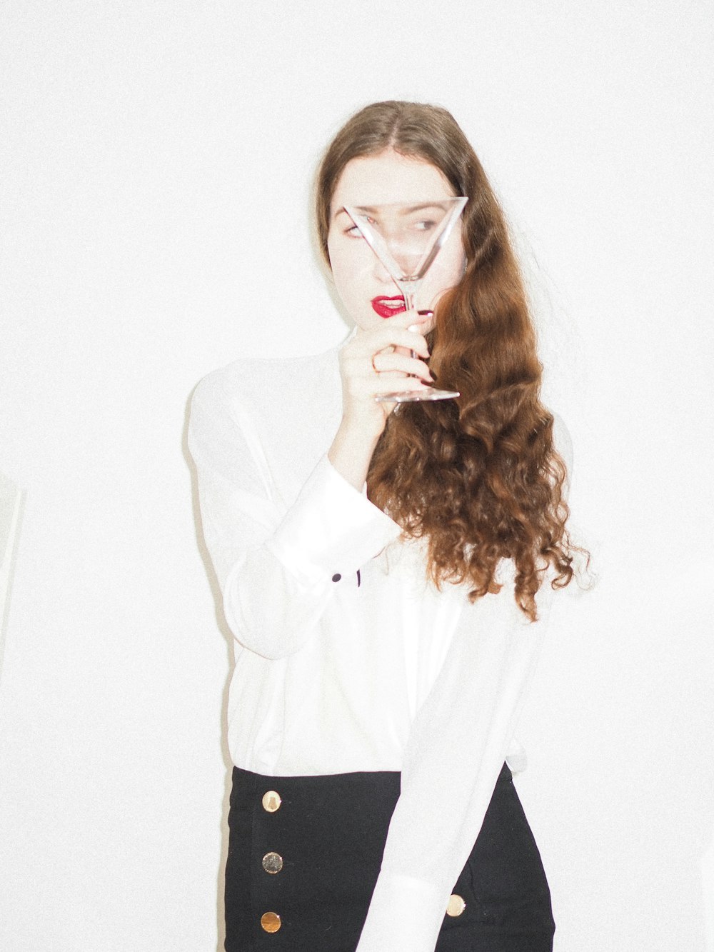 woman in white long sleeve shirt and black pants