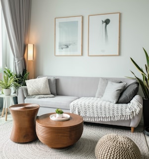 a living room filled with furniture and a large window