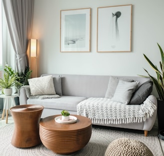 a living room filled with furniture and a large window