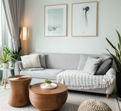 a living room filled with furniture and a large window