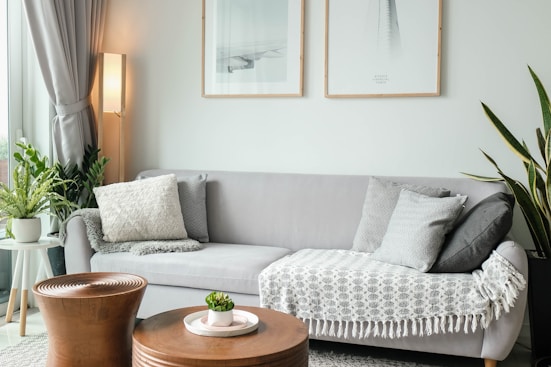 a living room filled with furniture and a large window