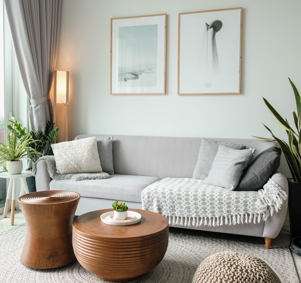 a living room filled with furniture and a large window