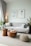 a living room filled with furniture and a large window