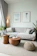 a living room filled with furniture and a large window
