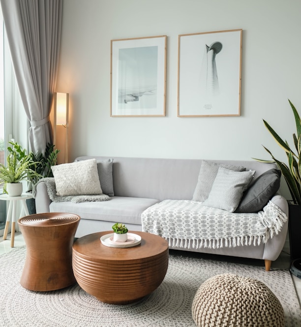 a living room filled with furniture and a large window