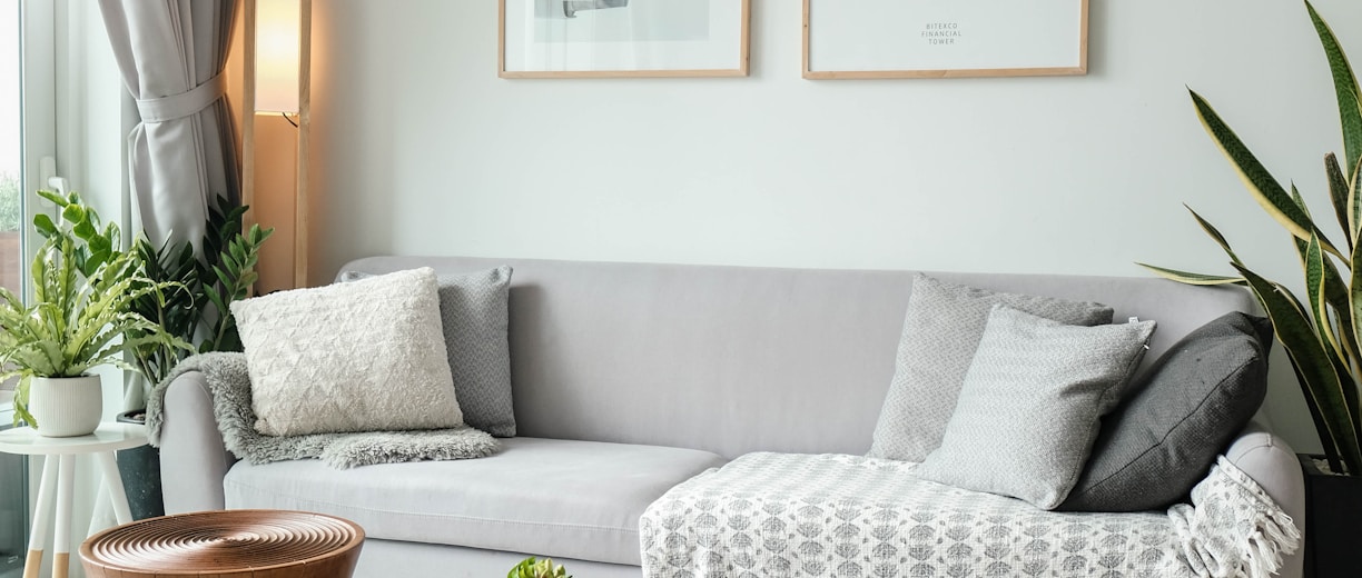 a living room filled with furniture and a large window