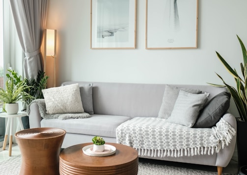 a living room filled with furniture and a large window