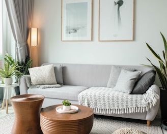 a living room filled with furniture and a large window