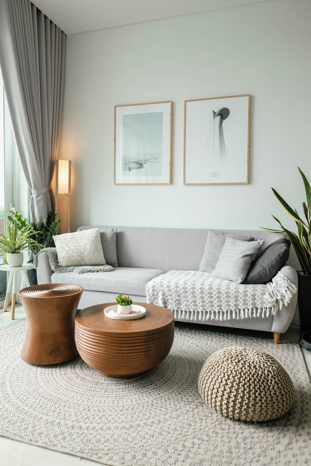 a living room filled with furniture and a large window