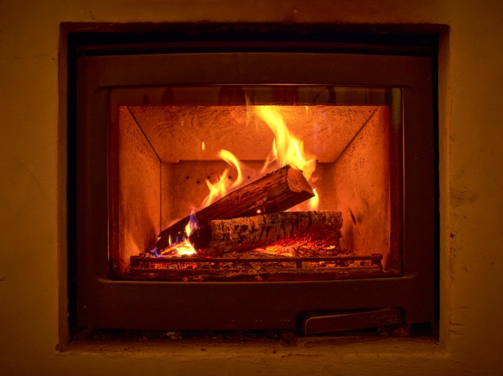 brown wood burning in fire pit