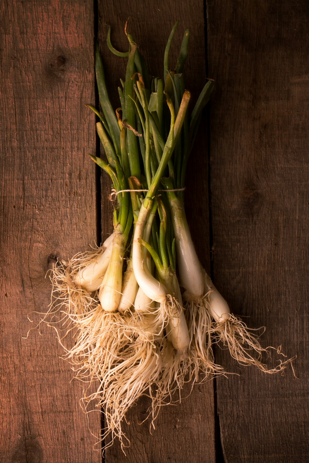 green and white vegetable on brown wooden table