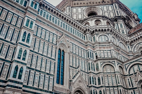 brown and blue concrete building in Cathedral of Santa Maria del Fiore Italy
