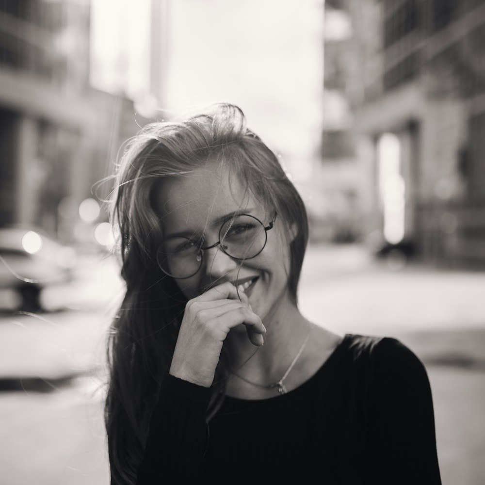 woman in black crew neck shirt wearing eyeglasses