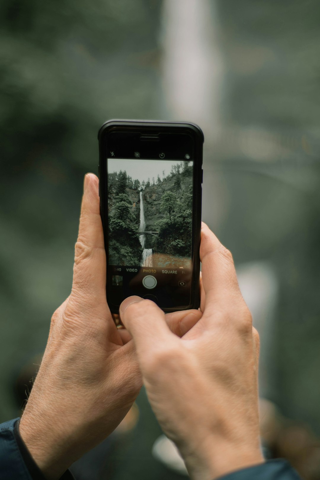 person holding black iphone 4