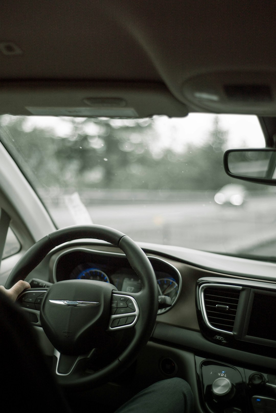 person driving car during daytime