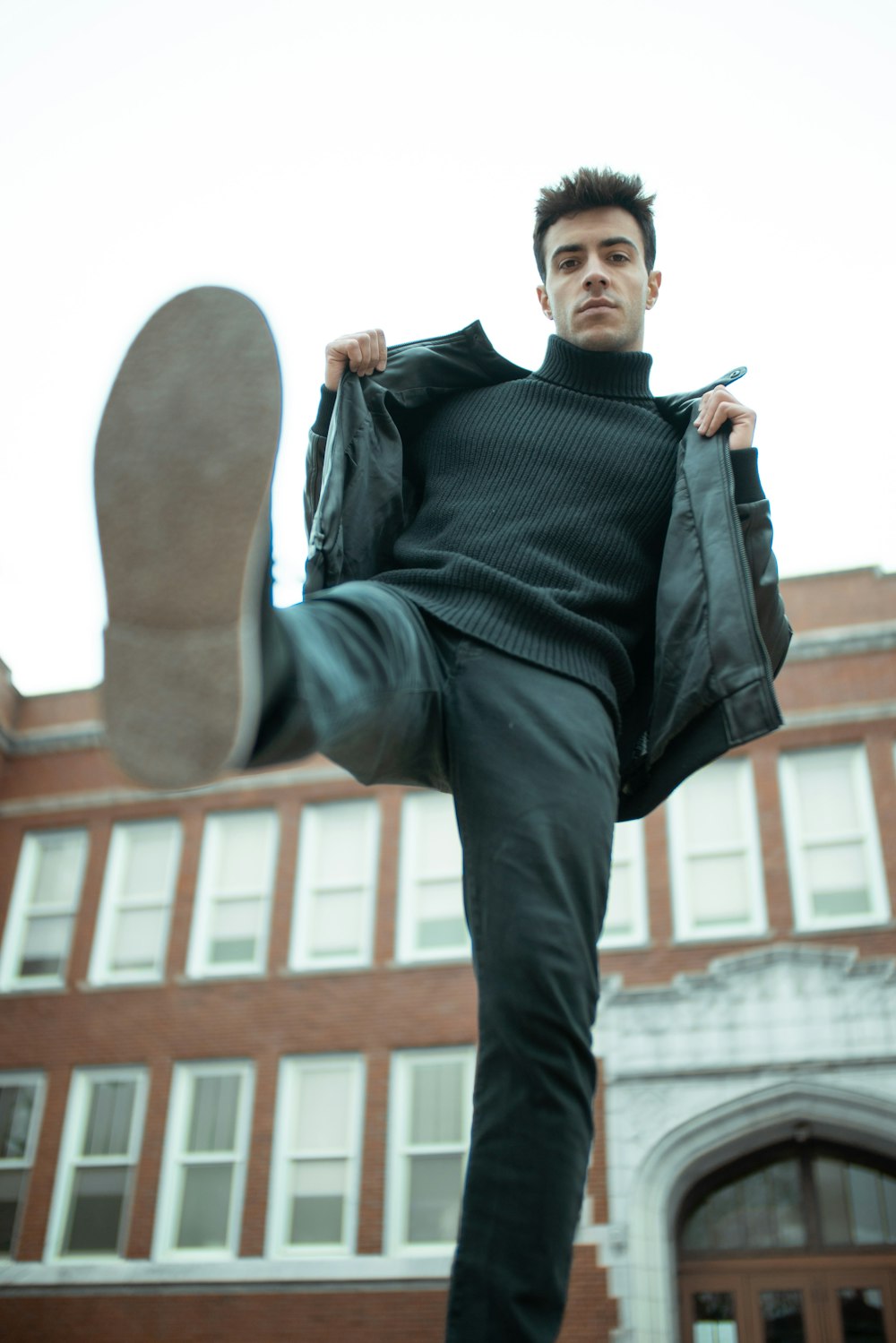 man in black leather jacket and black pants