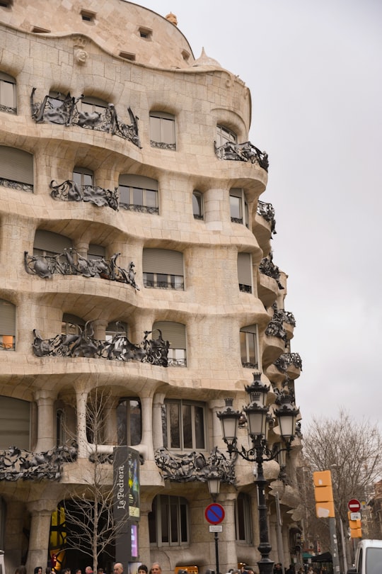 white concrete building during daytime in Casa Mila Spain