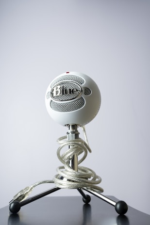 A compact microphone on a stand, ideal for streaming and podcasting beginners.