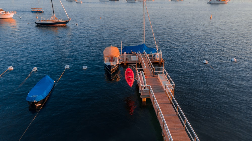 brown wooden boat on body of water during daytime