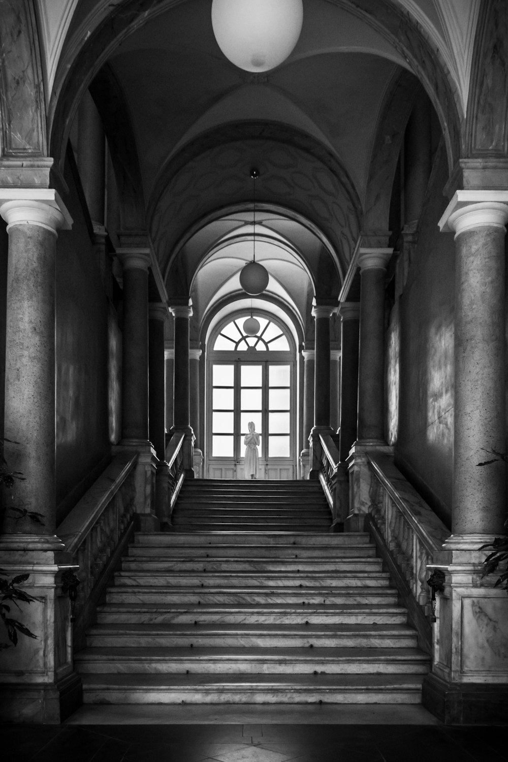 grayscale photo of wooden stairs