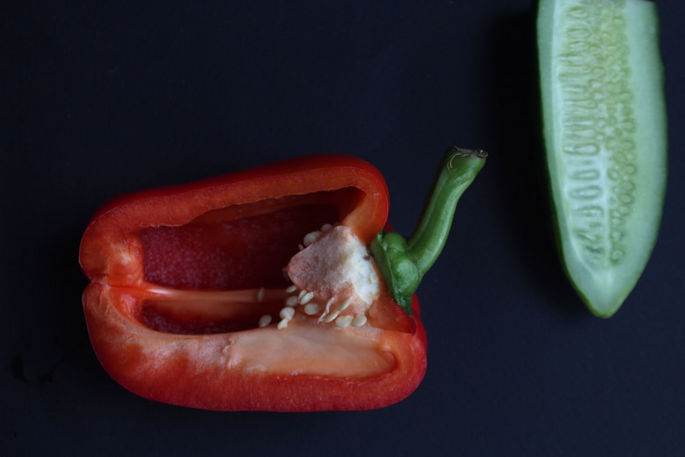 red bell pepper on black surface