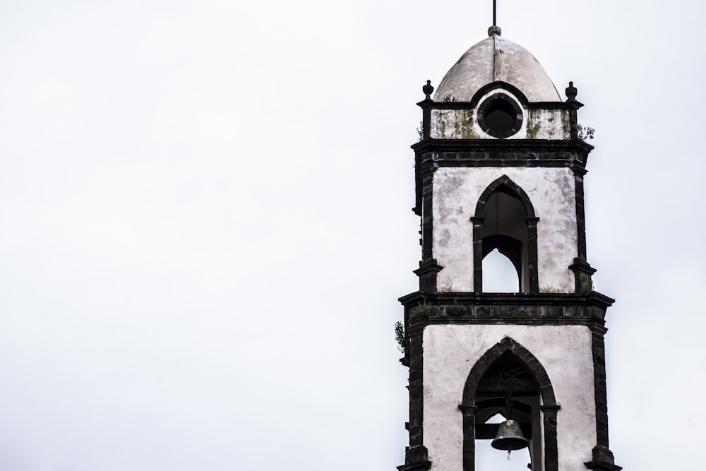 brown concrete tower under white sky during daytime