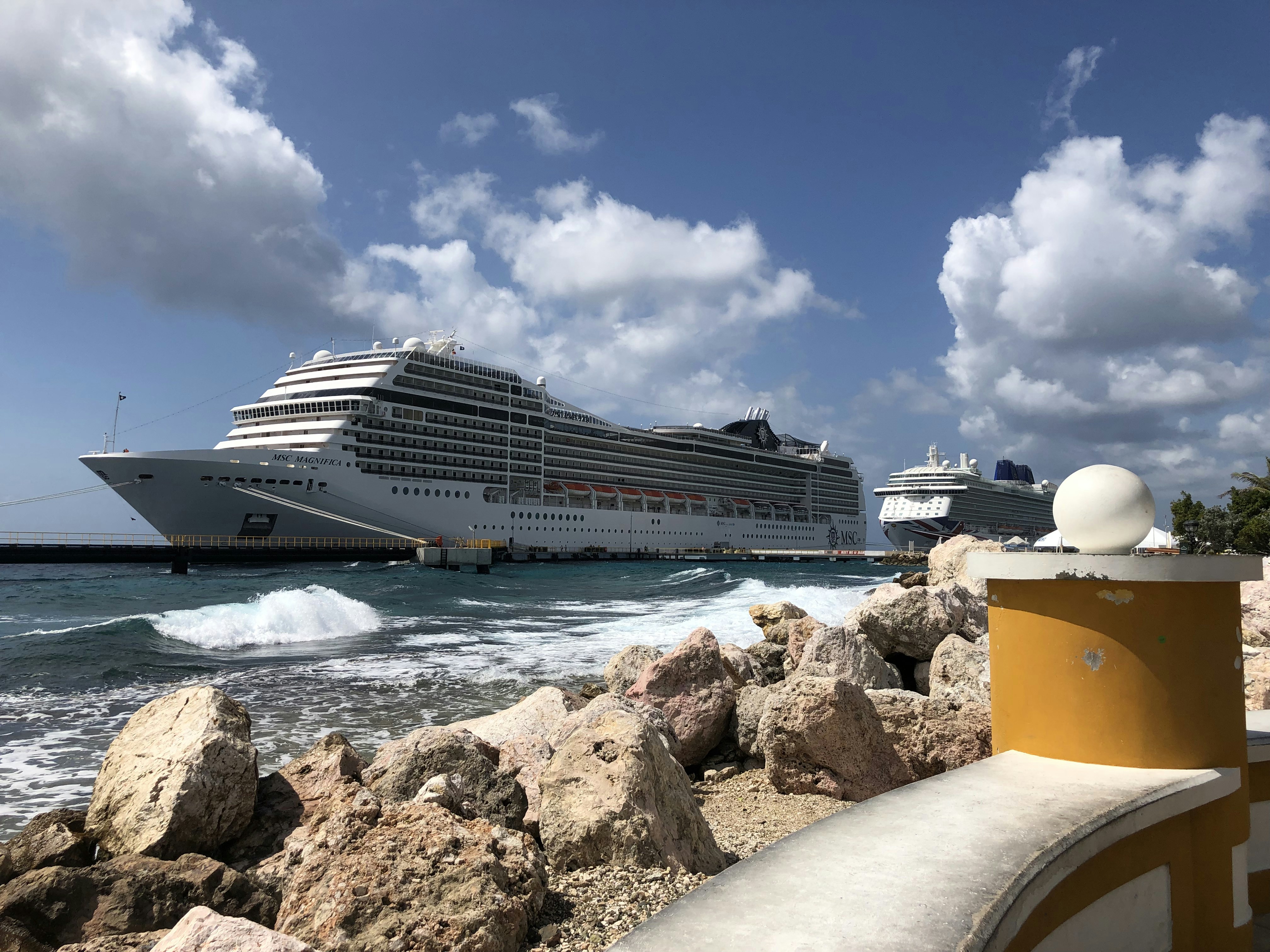white cruise ship on sea under blue sky during daytime