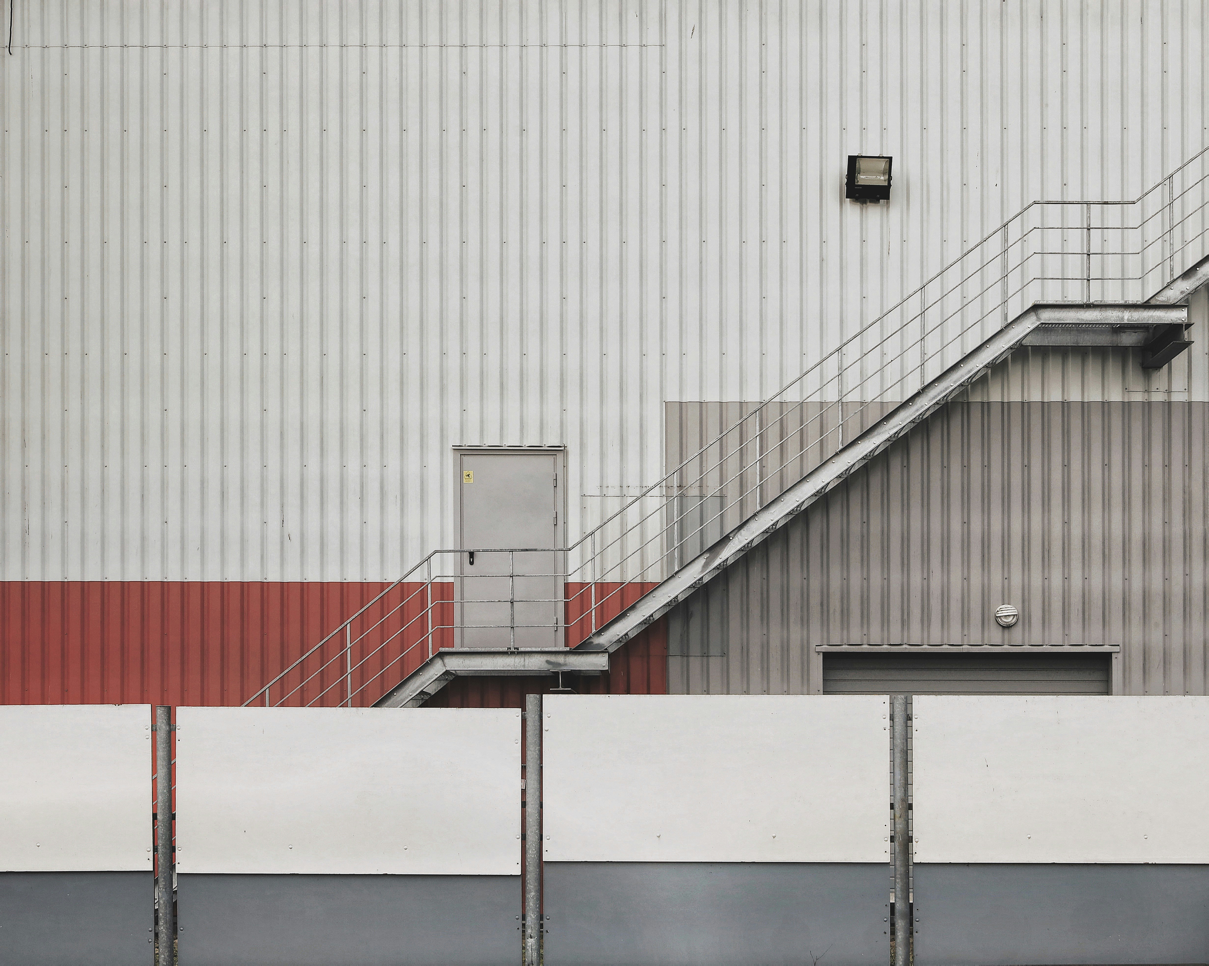 white and red metal railings