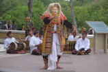 Students enthusiastically performing traditional Balinese dance outdoors.