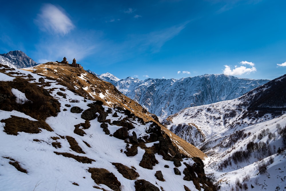 snow covered mountain under blue sky during daytime