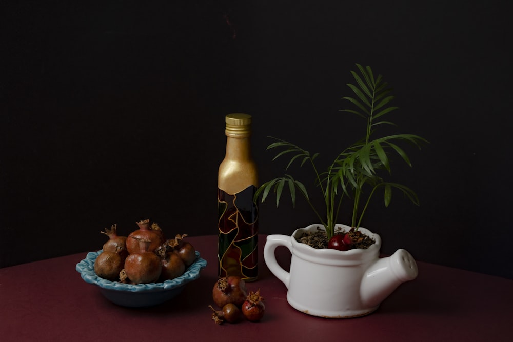 white ceramic teapot beside white ceramic teapot