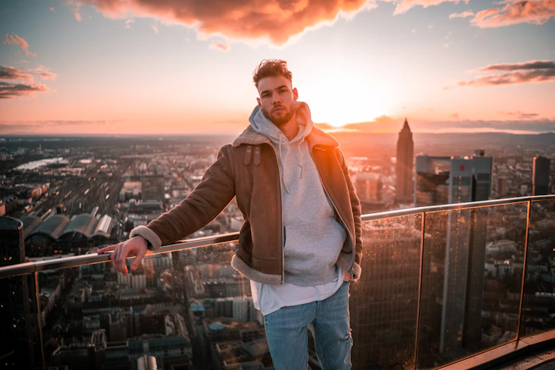 Man overlooking the city from a tall building