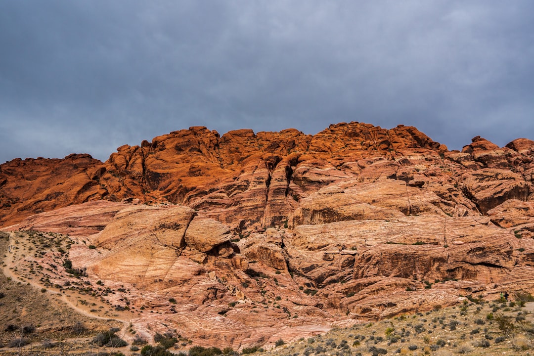 brown rock formation under white clouds during daytime