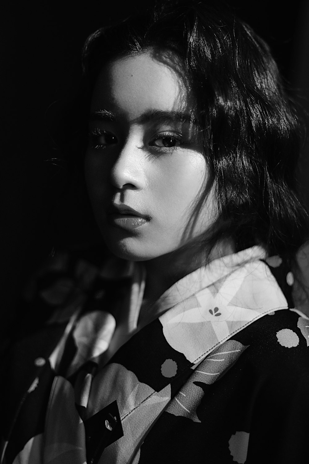 woman in white and black floral shirt