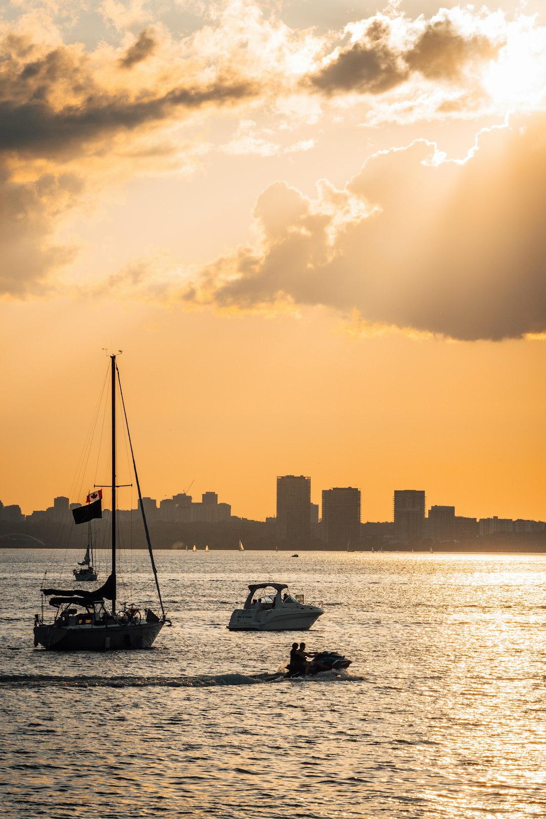 silhouette of boat on sea during sunset