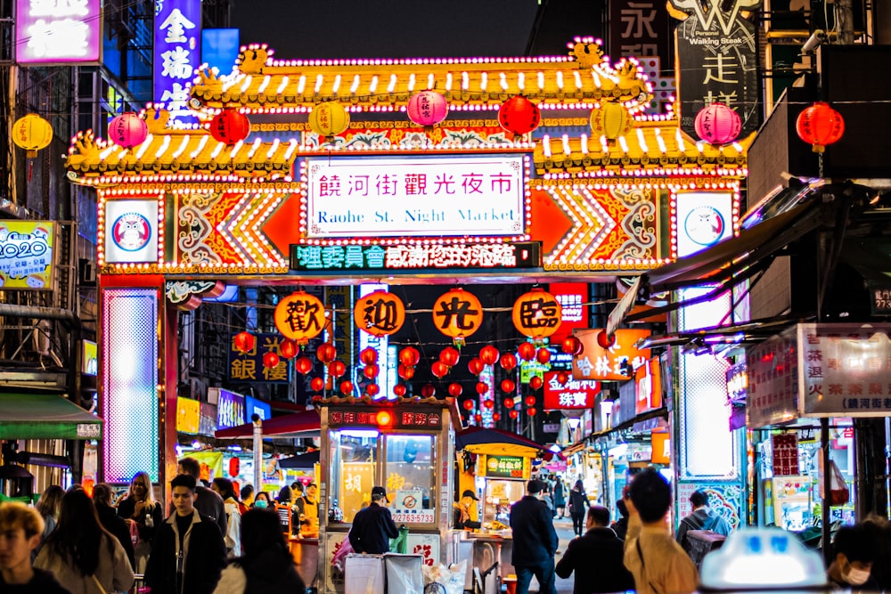 people walking on street during night time