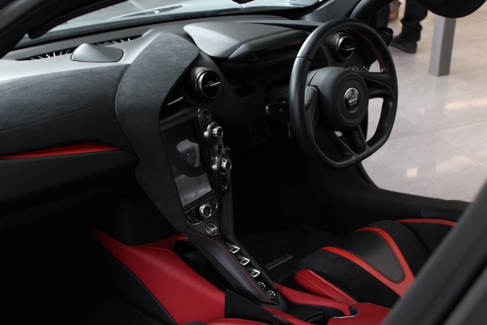 black and red car steering wheel